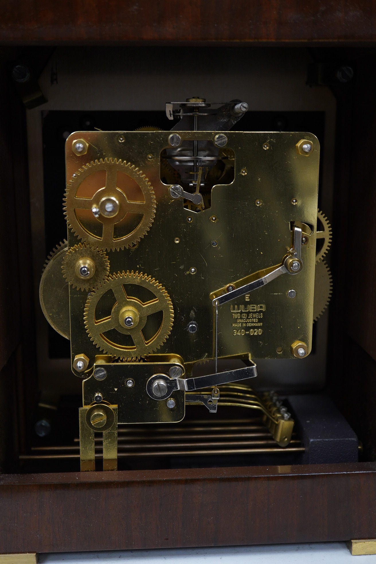 Two clocks including an American example, with keys and two military interest brass shells. Condition - fair